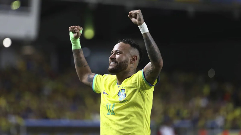 Neymar cheering with fans in the crowd